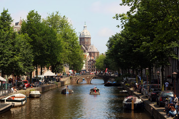 Naklejka premium Canal in Amsterdam from a bridge