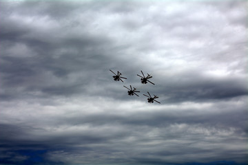 combat helicopters in the sky