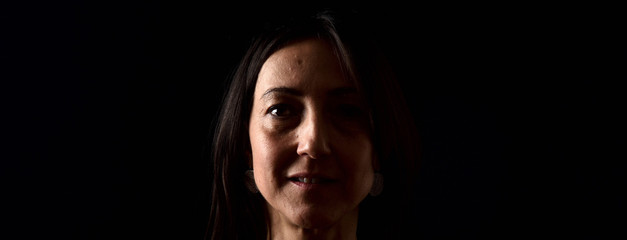 Fototapeta premium portrait of a woman on black