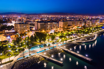 Limassol. Republic of Cyprus night panorama. Night Molos embankment. Limassol's promenade protruding into the sea from height. The mediterranean seaside. The Cyprus beaches. Traveling to the Cyprus.