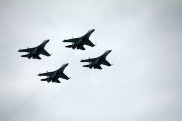 Fototapeta na wymiar four combat aircraft in the sky