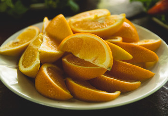 Vegetables and fruits are sliced on a wooden table. Picnic in the summer. Fresh vegetables. Party in nature.
