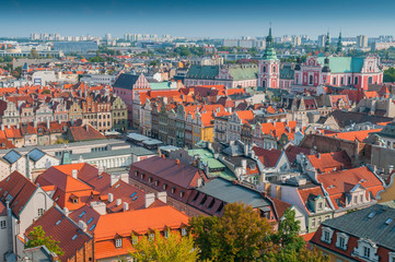 Fototapeta na wymiar View from Castle tower on old town buildings and collegiate church in center of polish city Poznan, Poland.