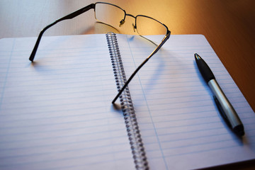 Open White Lined Notebook, Pen and Glasses 5 - obrazy, fototapety, plakaty