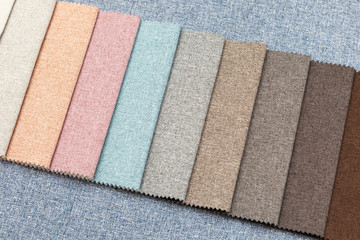 Multi-colored samples of upholstery fabric for sofas and chairs close-up.