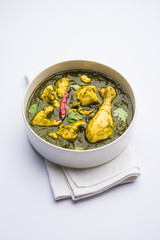 palak/spinach Chicken or Murg Saagwala served in a bowl with Naan and rice