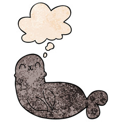 cartoon seal and thought bubble in grunge texture pattern style