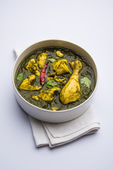 palak/spinach Chicken or Murg Saagwala served in a bowl with Naan and rice