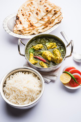 palak/spinach Chicken or Murg Saagwala served in a bowl with Naan and rice