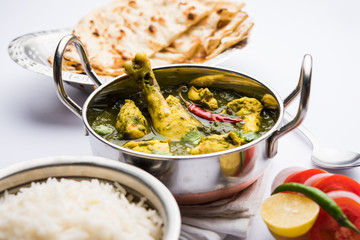 palak/spinach Chicken or Murg Saagwala served in a bowl with Naan and rice