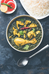 palak/spinach Chicken or Murg Saagwala served in a bowl with Naan and rice