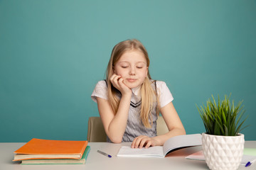 education and school concept - smiling little student girl with many books a