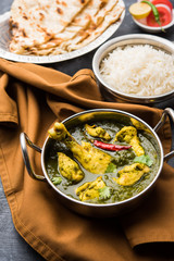 palak/spinach Chicken or Murg Saagwala served in a bowl with Naan and rice