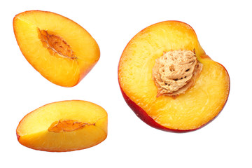 Nectarine with green leaf and slices isolated on white background. top view