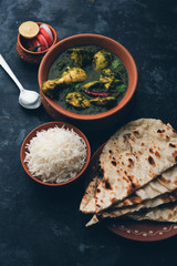 palak/spinach Chicken or Murg Saagwala served in a bowl with Naan and rice