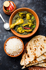 palak/spinach Chicken or Murg Saagwala served in a bowl with Naan and rice
