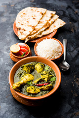 palak/spinach Chicken or Murg Saagwala served in a bowl with Naan and rice