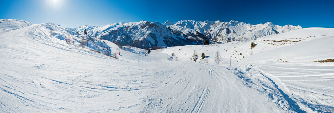 View down a piste in alpine ski resort