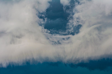Naklejka na ściany i meble Volumetric cumulonimbus clouds - entrance to the sky