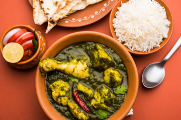 palak/spinach Chicken or Murg Saagwala served in a bowl with Naan and rice