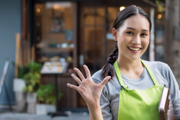 happy smiling woman entrepreneur, asian small business owner pointing up 5 fingers; five important...