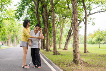 Obraz premium Senior asian woman with faint sitting on floor after falling down,Take care and support concept