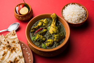 palak/spinach Chicken or Murg Saagwala served in a bowl with Naan and rice