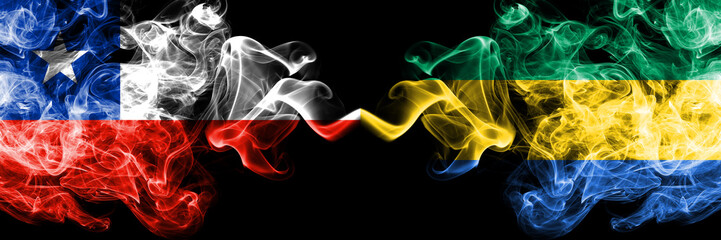 Chile vs Gabon, Gabonese smoky mystic flags placed side by side. Thick colored silky smokes...