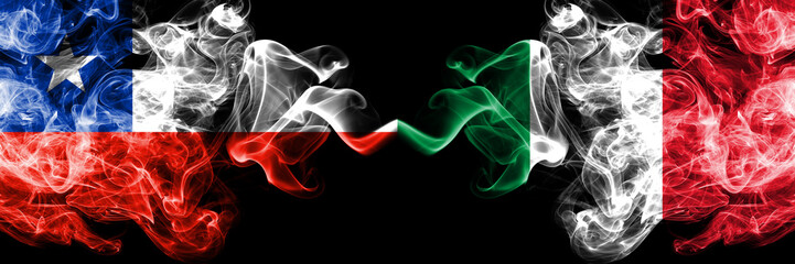 Chile vs Italy, Italian smoky mystic flags placed side by side. Thick colored silky smokes combination of Italy, Italian and Chilean flag