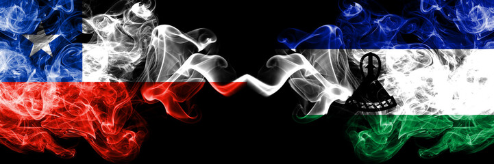 Chile vs Lesotho smoky mystic flags placed side by side. Thick colored silky smokes combination of...