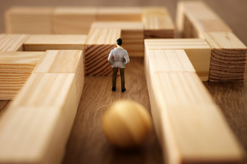 business concept Image of challenge. A man stands in the maze looking for the exit and unaware of...