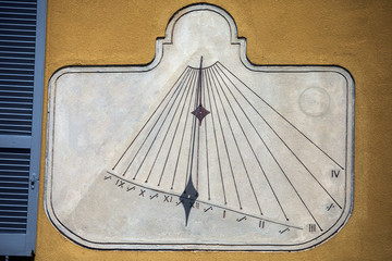 Vintage sundial on a wall