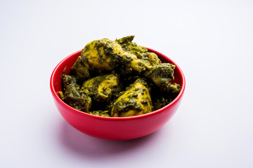 palak/spinach Chicken or Murg Saagwala served in a bowl with Naan and rice