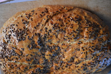 Beautiful very hearty bread homemade recipe. Brown bread with crispy crust, black caraway seeds and brown flax kernels.