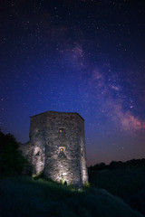 Kudryntsi Castle with illuminate under night sky with Milky Way