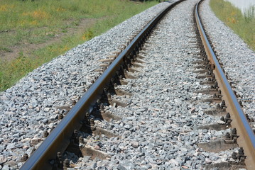 Repaired railroad tracks for freight trains with updated gray stone.