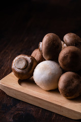 Close-up of fresh champignon mushrooms on wooden table