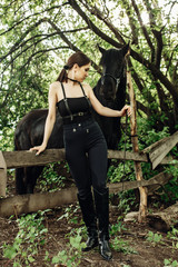 Buttom view of beautiful woman and expensive breed hourse. Outdoor shot, sport and fashion concept.