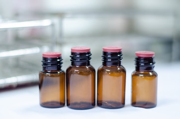 Blank brown bottle reagent in laboratory.