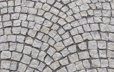 Old road paved with granite stones.