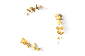 Flat lay of golden tropical leaf design elements. Decoration elements for invitation, wedding cards, valentines day, greeting cards. isolated over white background. Top view