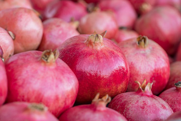 Group of pomegranates closeup, selective focus.
