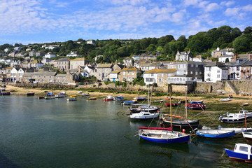 Fototapeta na wymiar Mousehole Village & Harbour with boats, in Cornwall, England, Uk