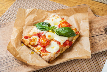 slice of italian pizza in the pizzeria