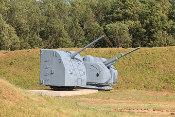 Old artillery guns in fortifications on shore