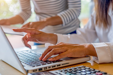 Business team brainstorming and discussing with financial data and report graph. Teamwork meeting working concept.