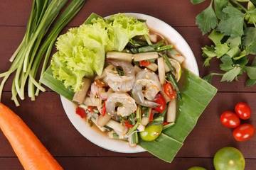 Hot and spicy sour Thai Salads. With Lotus stem Field CRAB and Chopped Mango. Black CRAB.