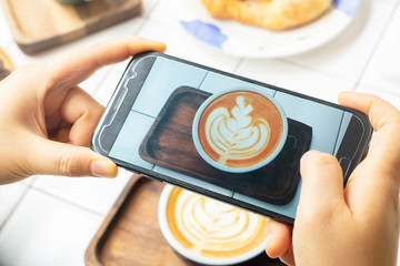 take photo latte coffee with mobile phone