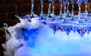 fresh modern coctail on the black background with smoke