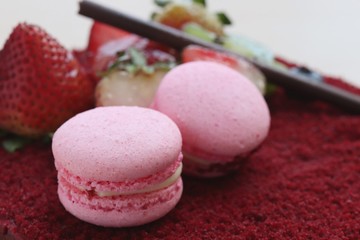 pink macaroon on top red valet cake